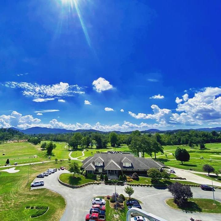 Golf course under blue sky